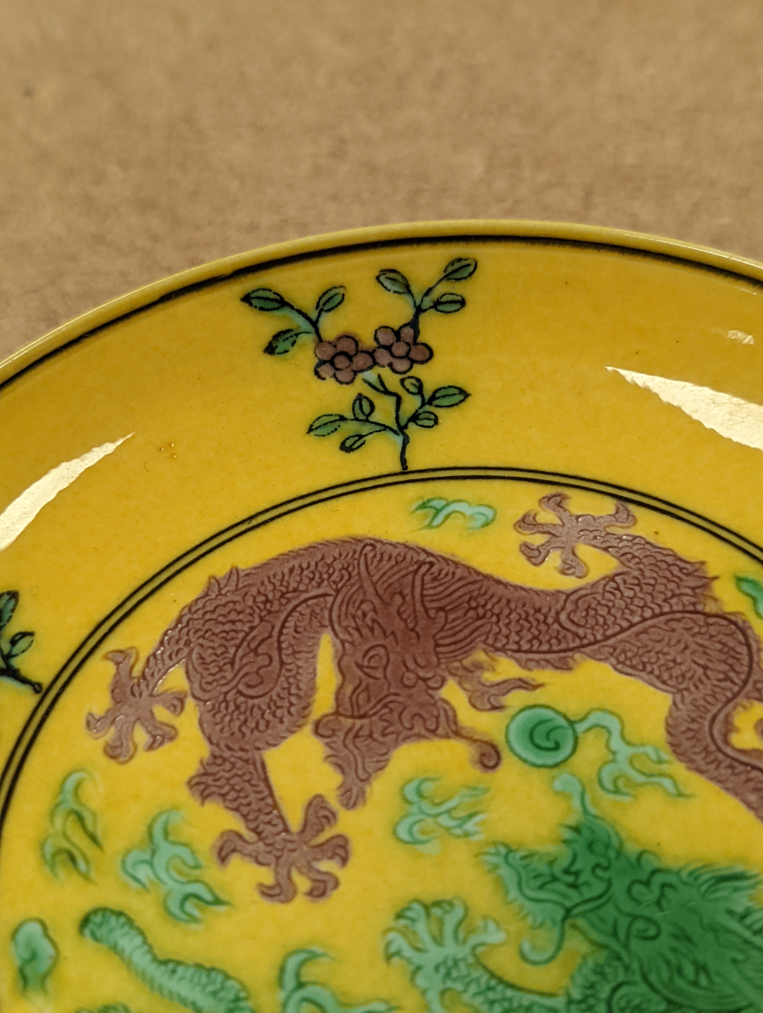 A Chinese yellow ground green and aubergine enamelled 'dragon' dish, Guangxu mark and possibly of the period, D.11cm